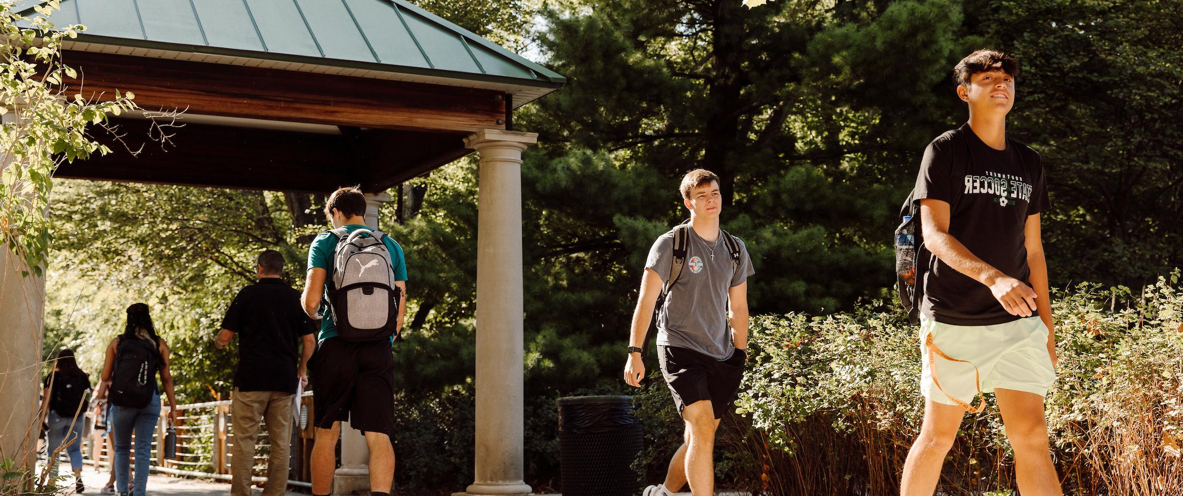 Students walking on bridge